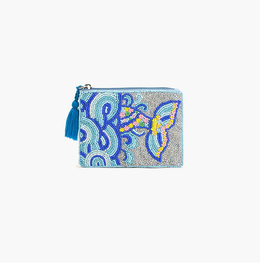 Decorative pouch with colorful patterns and tassels on a white background