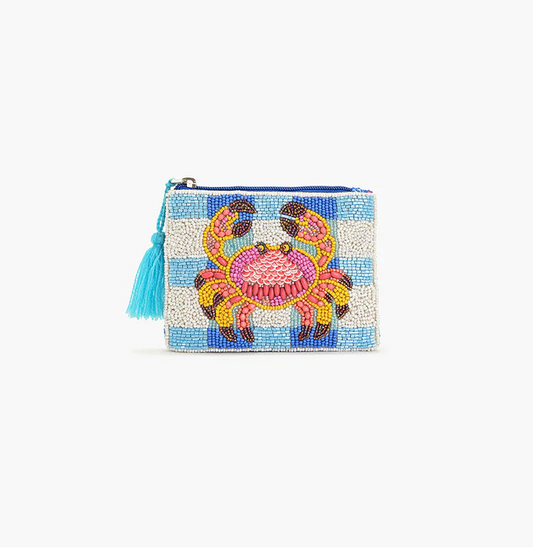 Beaded clutch with a colorful crab design on a light blue background