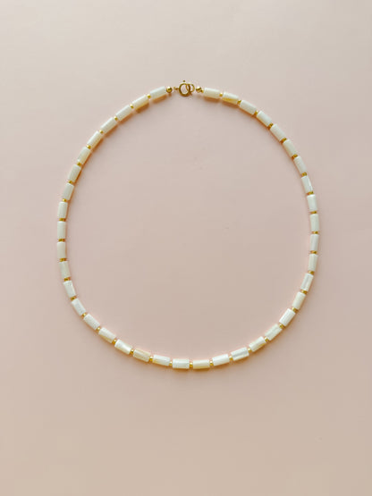 Mother of Pearl Cylinder with Gold Necklace