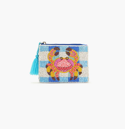 Beaded clutch with a colorful crab design on a light blue background